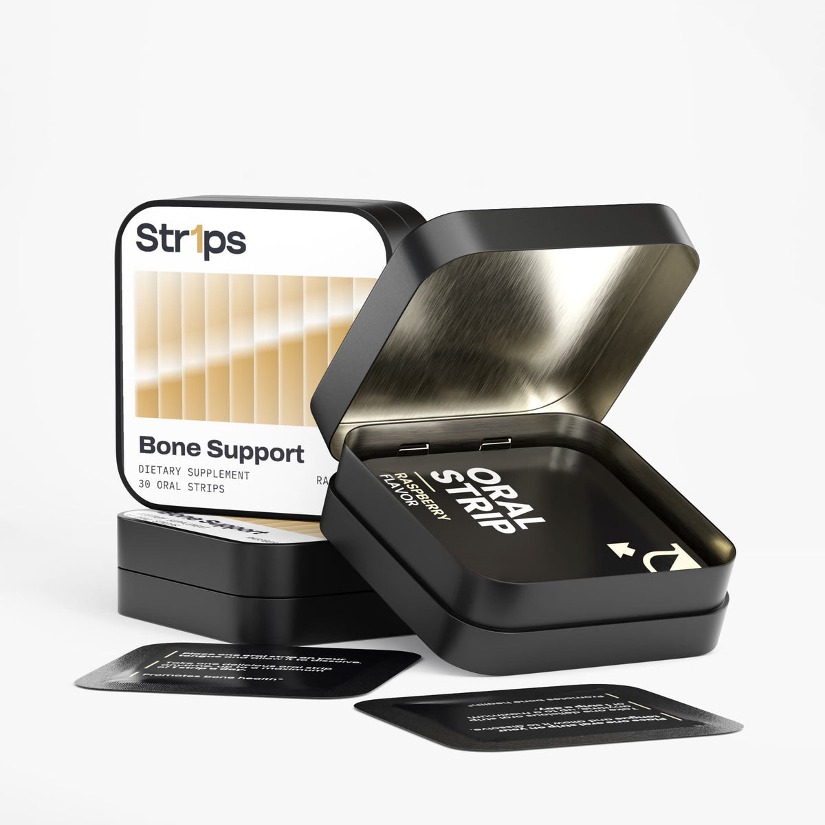 A black metal oral supplement tumbler with an open lid, showing a black oral strip inside, alongside a branded product box labeled Strips Bone Support and two small instruction cards on a clean white background.